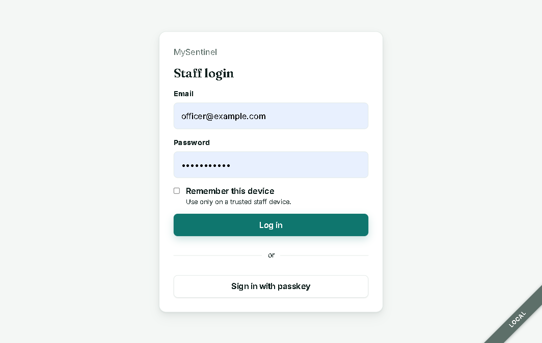 Staff login with passkey option and the "Environment: Local. This is not production." banner